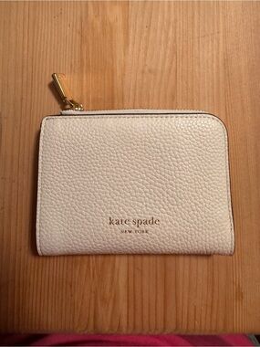 Kate Spade Cream Pebbled Leather Zip Around Wallet with Gold Logo
